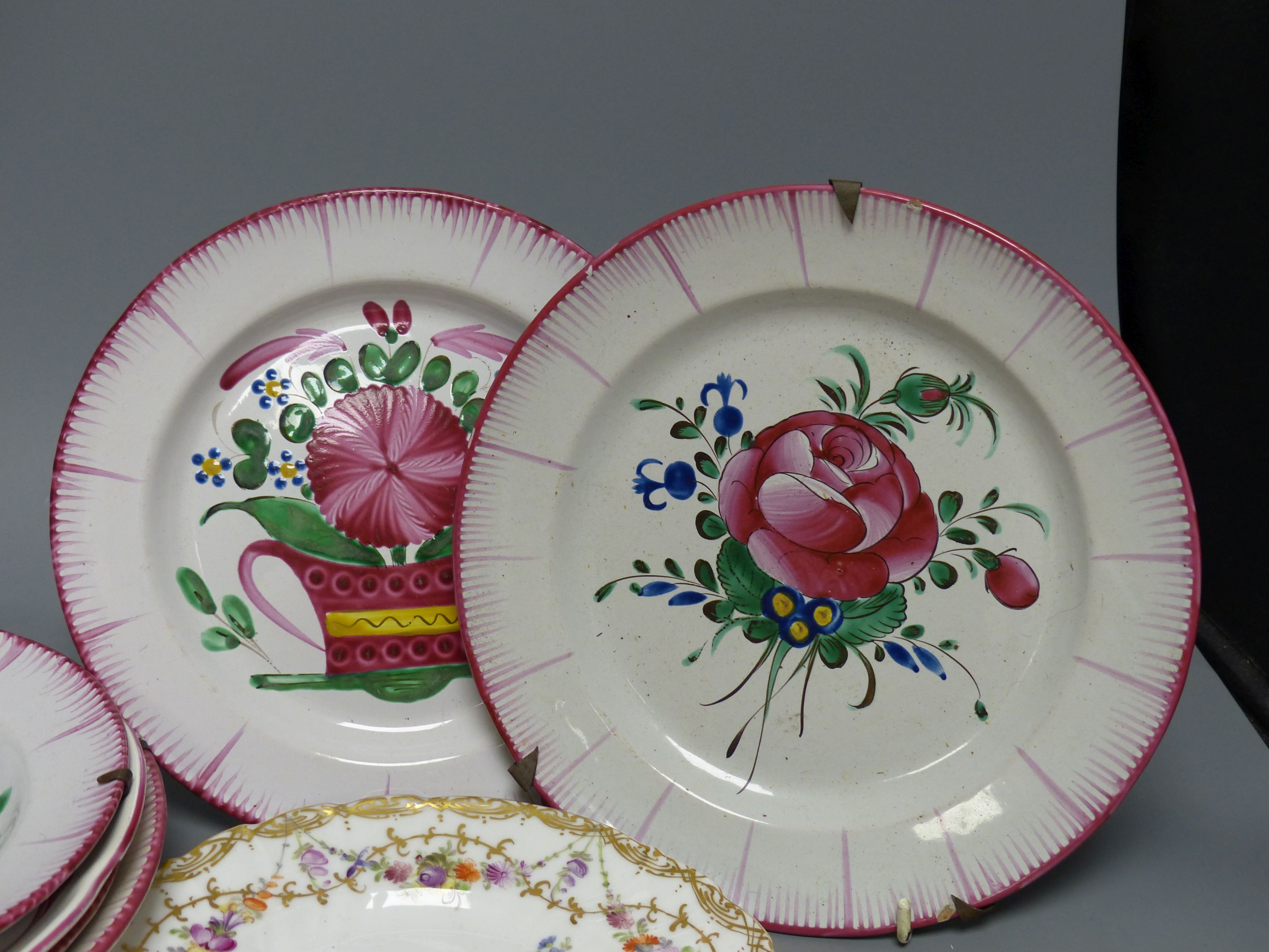 Seven French faience plates and a Dresden plate